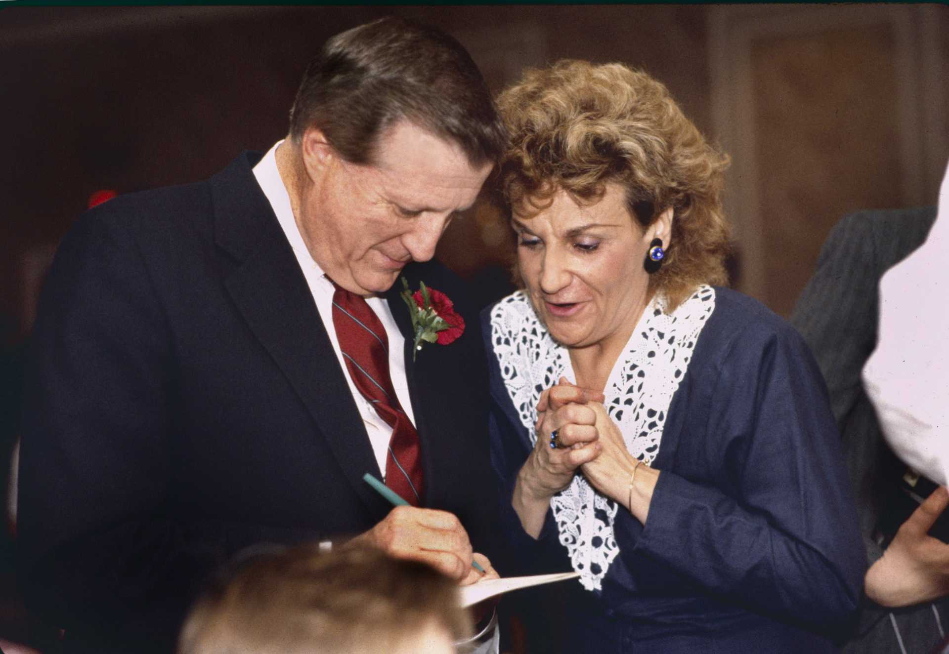 George Steinbrenner, owner of the New York Yankees signs an autograph for a clearly enthralled fan.