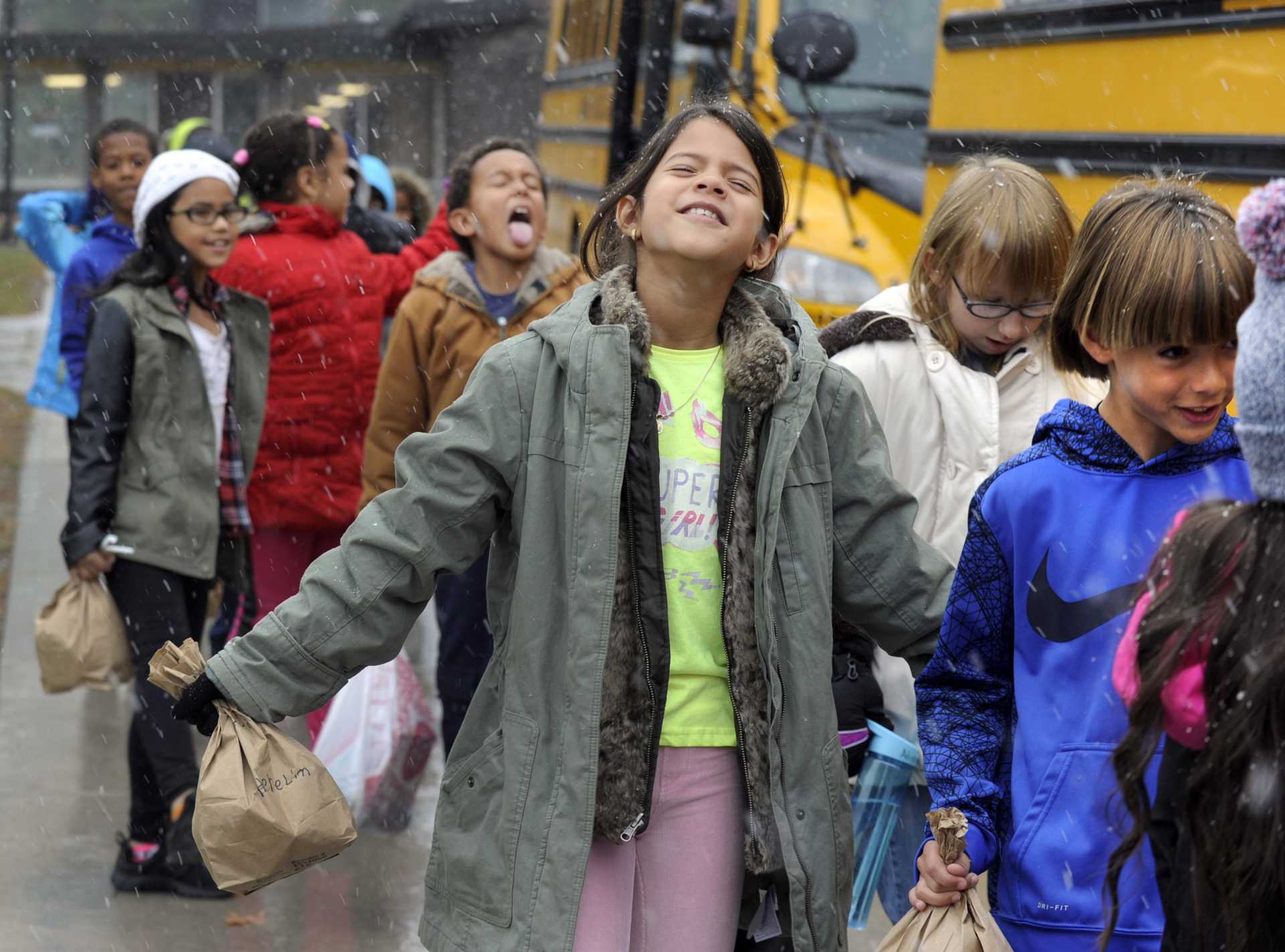 Herelin Guillermo, 8, a recent immigrant from the Dominican Republic, experiences snow for the first time.